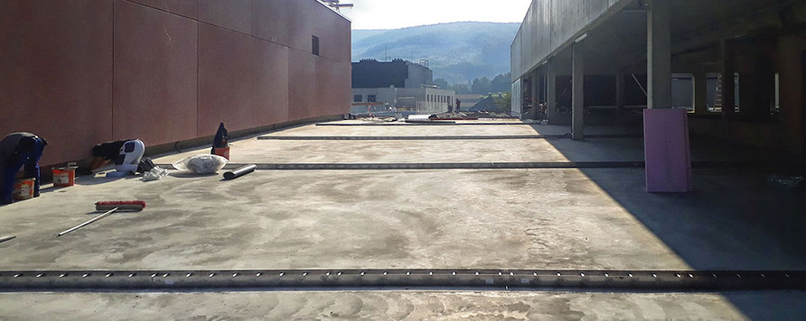 Egyedi vízelvezetési megoldás az IST új parkolójában – a BG-Graspointner teljeskörű kivitelezésével